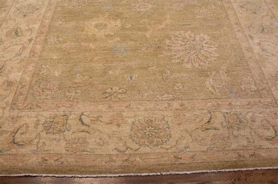 A softly colored green rug with pastel and brown colors made of wool. Size 8.2x10.