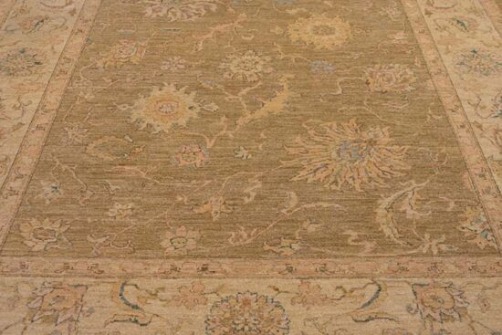 A softly colored green rug with pastel and brown colors made of wool. Size 8.2x10.