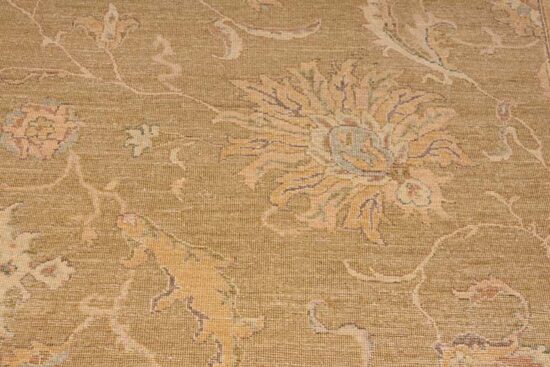 A softly colored green rug with pastel and brown colors made of wool. Size 8.2x10.