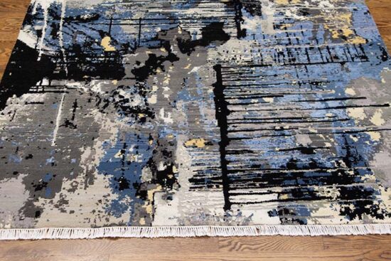 Decorative abstract area rug in black and blue colors made of wool and synthetic fibers. Size 5.2x7.5.