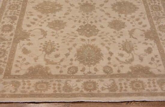 Oriental rug, floral taupe and cream oriental rug made from wool. Size 5x6.4.