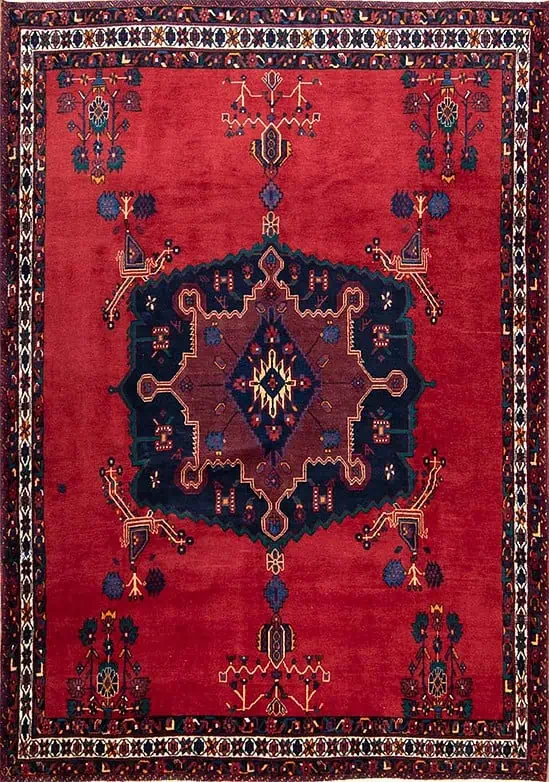 2644- Handmade Tribal Area Rug from Persia’s Sirjan region, woven in fine wool with a deep red field and bold navy medallion. This traditional Persian rug embodies timeless elegance and enduring craftsmanship, a true statement of Persian artistry. Available at Beautiful Rugs Chicago.