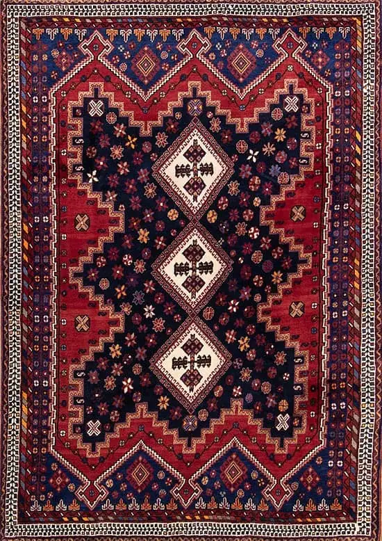 2646- This 5x8 geometric area rug from Sirjan, Iran is handmade from fine wool on a cotton foundation. Its bold navy blue and red geometric design reflects the artistry of traditional Persian weaving, available at Beautiful Rugs Chicago.