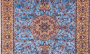 Handmade Persian silk rug in blue color and gold colors. Size 6.8x10. Handmade Persian silk rug in blue color and gold colors. Size 6.8x10.