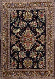 Handmade wool and silk rugs with intricate Persian floral design, shimmering silk highlights.