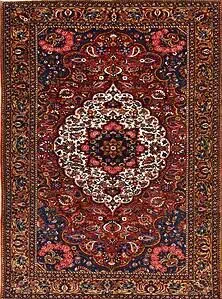 Oriental carpet, antique Persian Bakhtiari rug in red color and white medallion. Oriental carpet, antique Persian Bakhtiari rug in red color and white medallion.