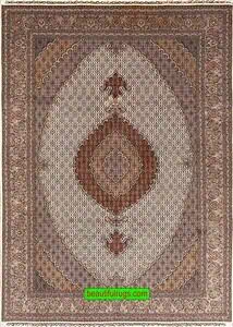 Hand knotted Tabriz wool and silk Persian area rugs for living room in beige and brown colors. Hand knotted Tabriz wool and silk Persian area rugs for living room in beige and brown colors.