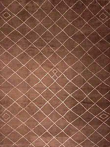 Moroccan style oriental rugs in checked design in brown color made of soft and fluffy wool. Moroccan style oriental rugs in checked design in brown color made of soft and fluffy wool.