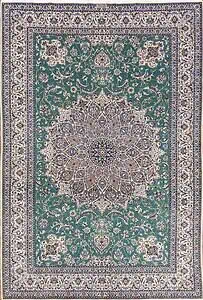 Persian Nain rug. Hand knotted Habibian Nain wool and silk rug in green color with 625 KPSI. Size 6.9x10. Persian Nain rug. Hand knotted Habibian Nain wool and silk rug in green color with 625 KPSI. Size 6.9x10.