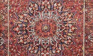Center medallion of an antique Persian Bakhtiari rug with terracotta red color. Center medallion of an antique Persian Bakhtiari rug with terracotta red color.