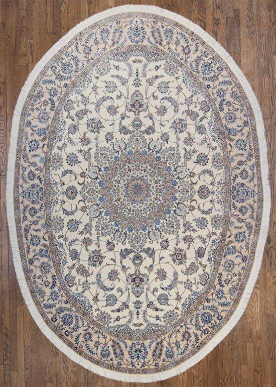 5442- Oval Rug Persian Nain Habibian 6x9 featuring an elegant ivory field with blue floral medallion design, hand knotted with fine wool and silk highlights. Beautiful Rugs Chicago.