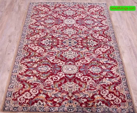 Persian Nain rug made of wool and silk in red color. Size 3.7x5.7