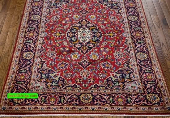 Handmade Persian Kashan wool rug in red color. Size 3.6x5.2.