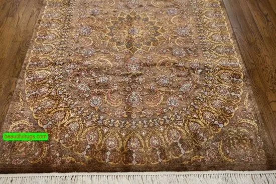 Handmade brown Persian silk rug with brown and gold colors. Size 4.4x6.9.