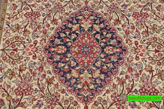 Hand knotted floral Persian Qum wool and silk rug in beige and navy blue color. Size 4.8x7.1.