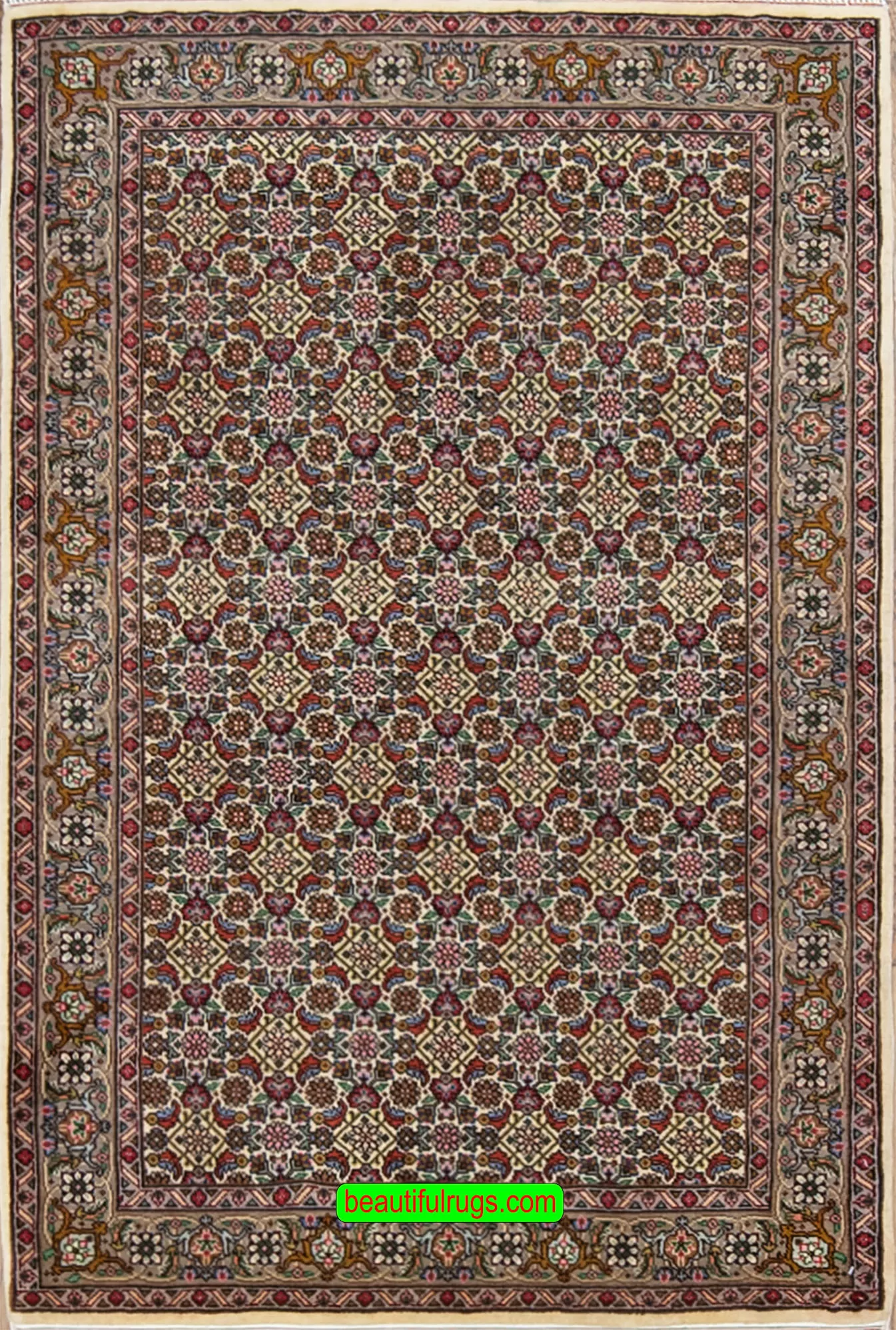 Handmade Persian area rug made of wool, multi color with pastel beige color in the main field and all-over design. Size 3.3x5.